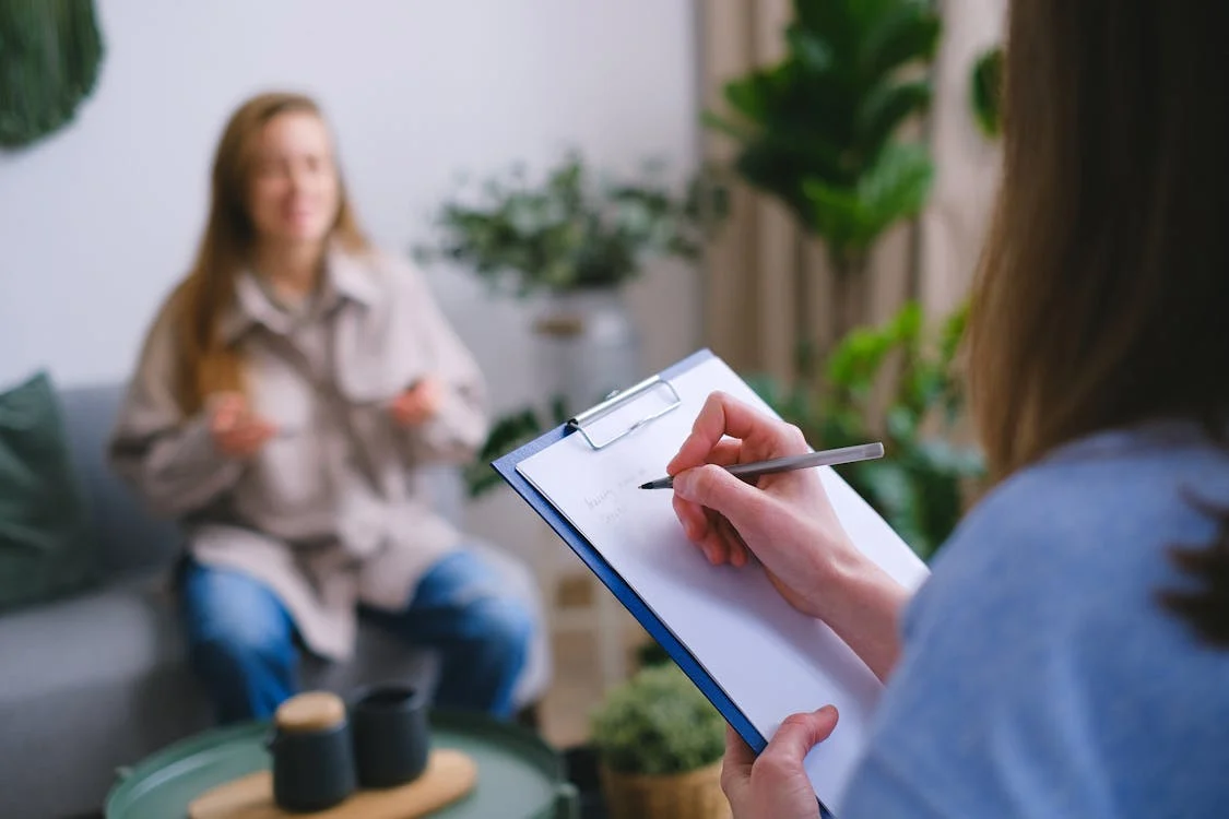 A therapist taking notes