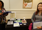 Alternative Therapy team members hosting an indoor community event