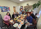 Alternative Therapy team gathered around a shared meal