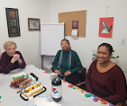 Alternative Therapy team members gathered at a table