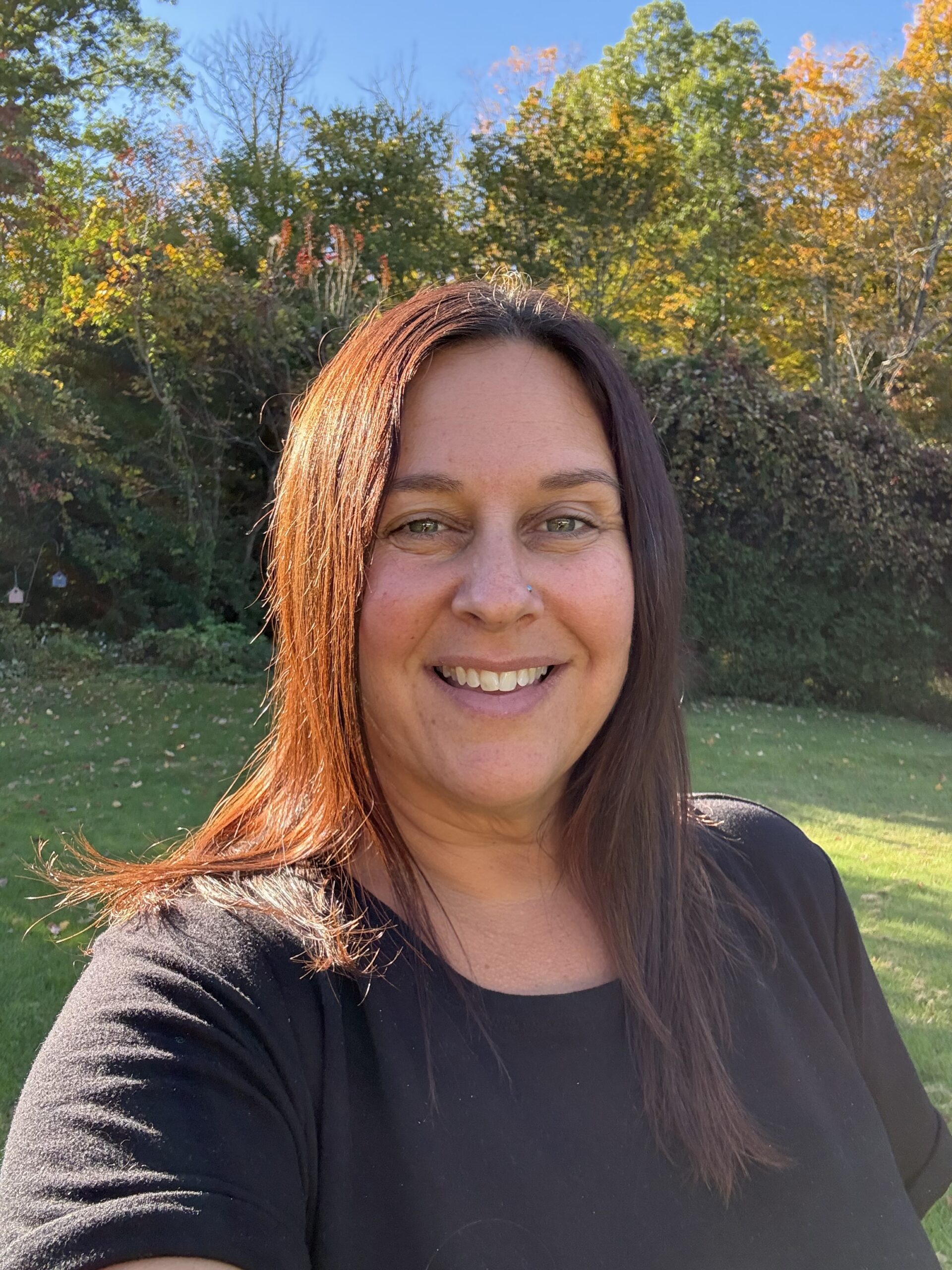 Kristine Barnes-Frattini smiling outdoors